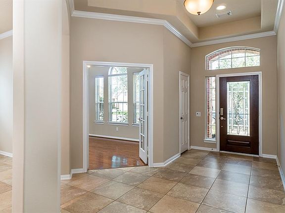 Enter through a leaded glass door, along with arched window & sidelight window, that allows the natural light to flow into the space!