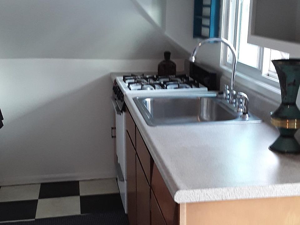 Cute kitchen with black and white floor
