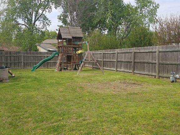 Backyard with wooden playset