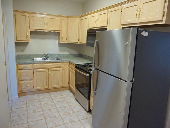 Custom cabinets, new stainless appliances, built in microwave, ceramic tile floors, deep bowl stainless sink.
