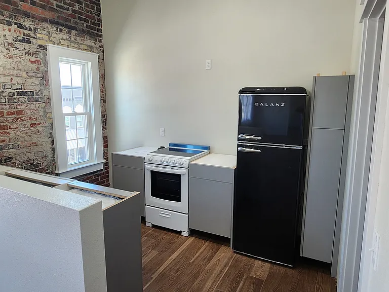 Retro kitchen. This photo was taken before the counters and vent hood added.