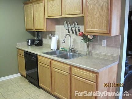 Kitchen
						:
						Hand laid tile backsplash and a new faucet are just a couple of great features