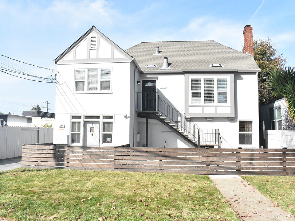Front of property, unit entrance at the top of the stairs