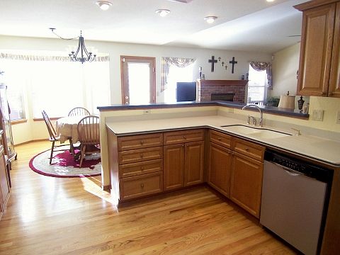 Wood Cabinetry, Stainless Appliances, Solid Surface Counters