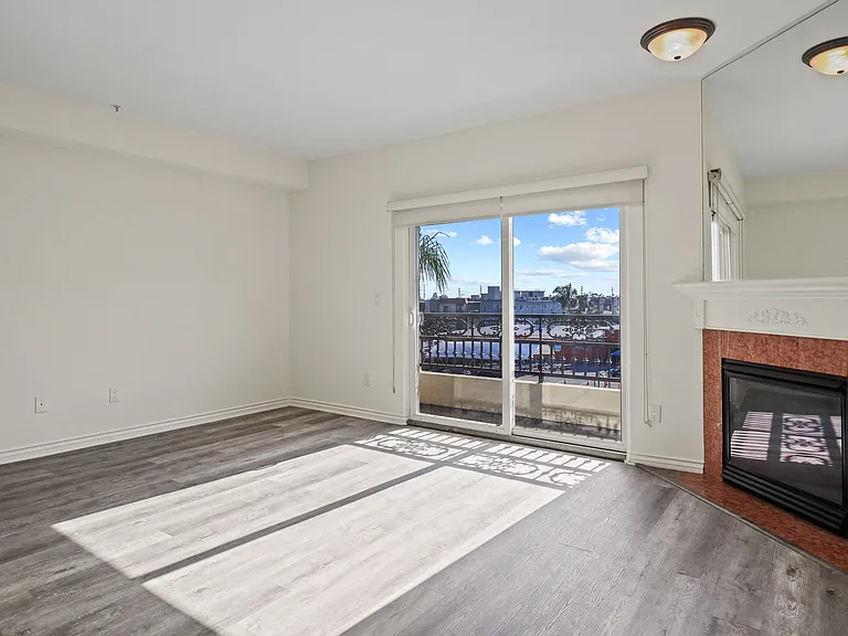 Large Living Room Space with Lots of Natural Light and a Private Balcony