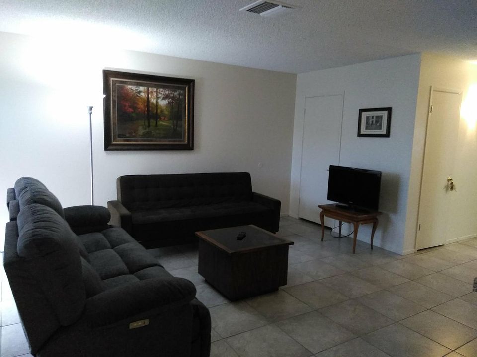 Living Room w/ futon and recliining couch