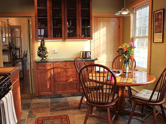 Newly remodeled kitchen with high end custom cabinetry, granite and stone tile with newer appliances