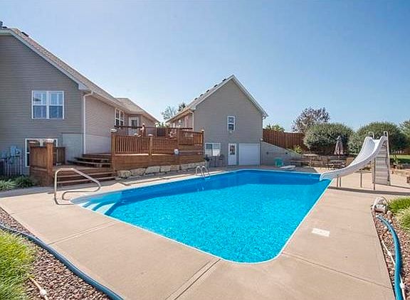 Heated In-ground Pool with a slide & diving board