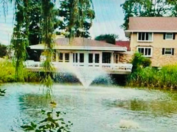 Pond on property with Club House.
