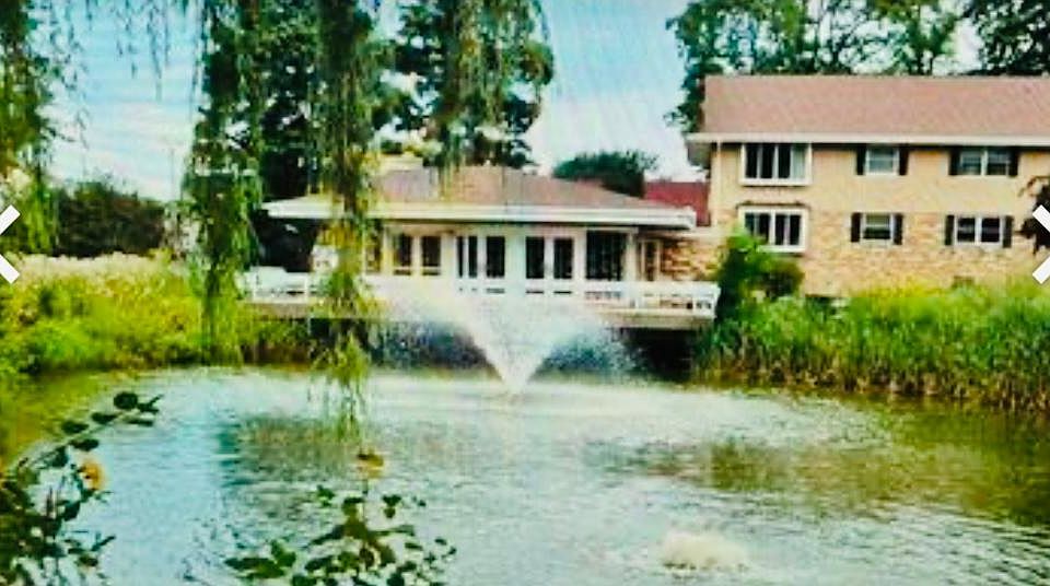 Pond on property with Club House.