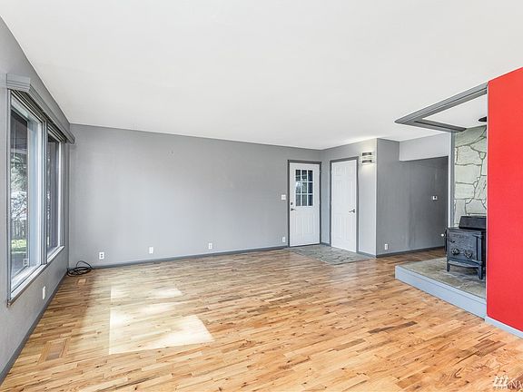 Hardwood floors throughout the living room, dining room and kitchen
