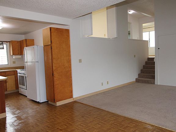 View of kitchen, living & dining area, looking toward the be
