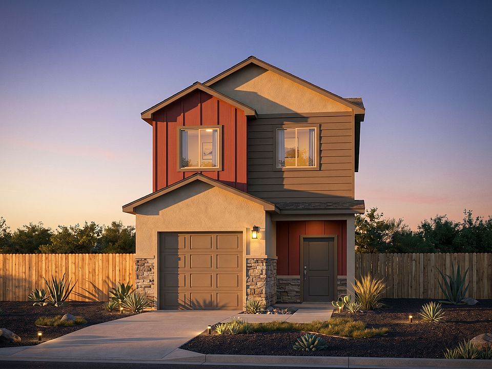 A modern two-story house with a mix of beige, red, and brown siding, stone accents, and a single-car