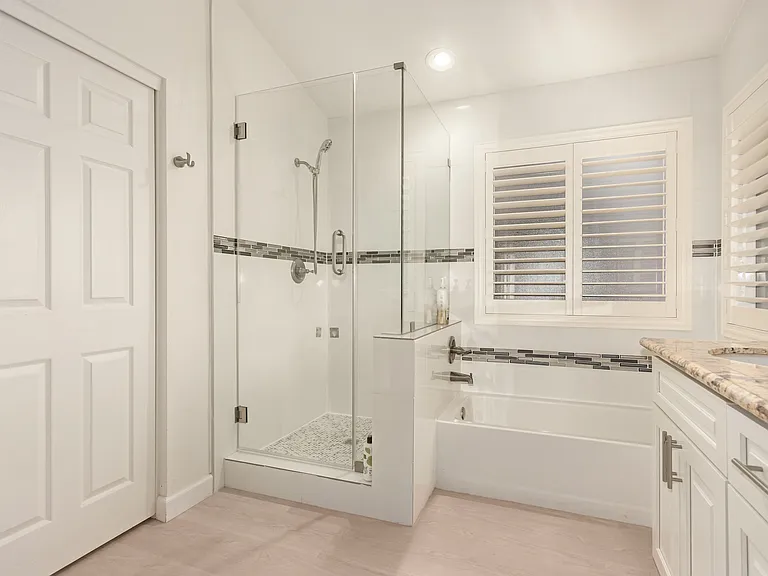 Primary Bathroom with Direct Access to the Walk-In Closet.