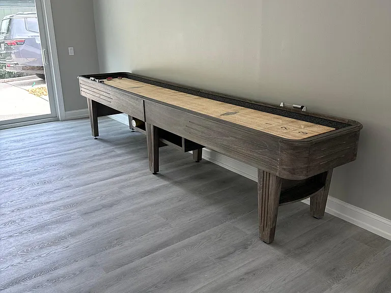 Shuffleboard table in game room