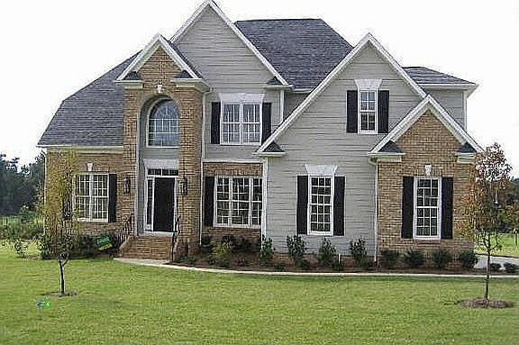 EXQUISITE CURB APPEAL-Nicely landscaped with sprinkler system