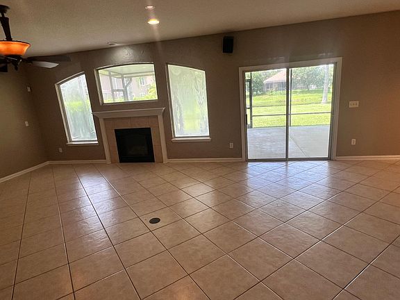 open living room with fireplace, overlooking man made pond, surround sound