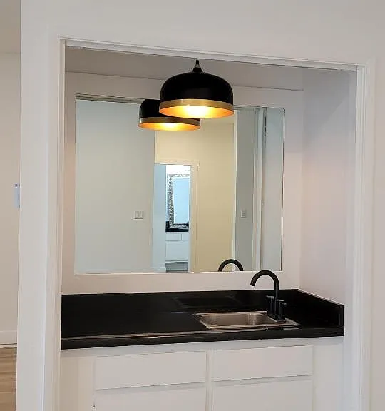 Modern wet bar adjacent to the living and dining areas.