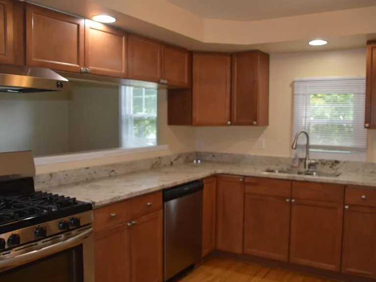 Spacious kitchen with stainless steel appliances and granite countertops