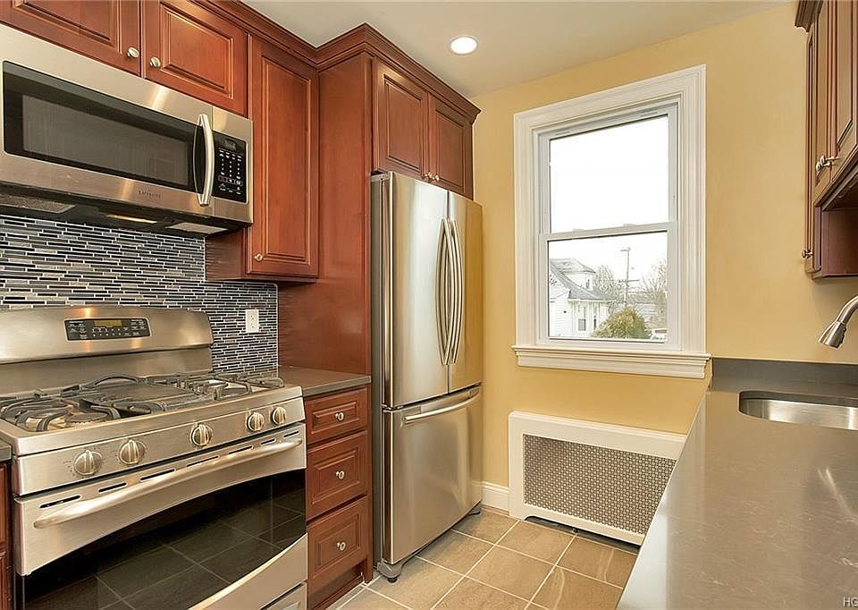 New quartz countertops in a freshly renovated kitchen.