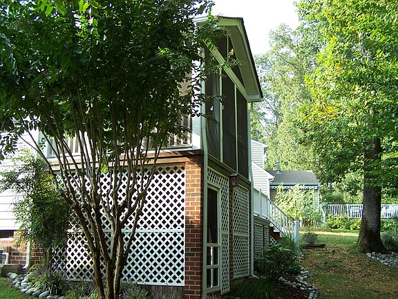 Potting shed below porch