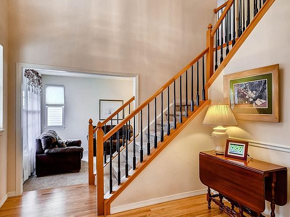 Bright 2 story foyer with refinished wood floors