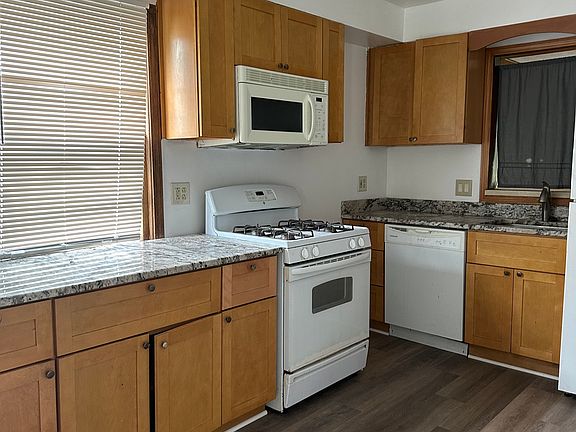Large open kitchen with granite countertop