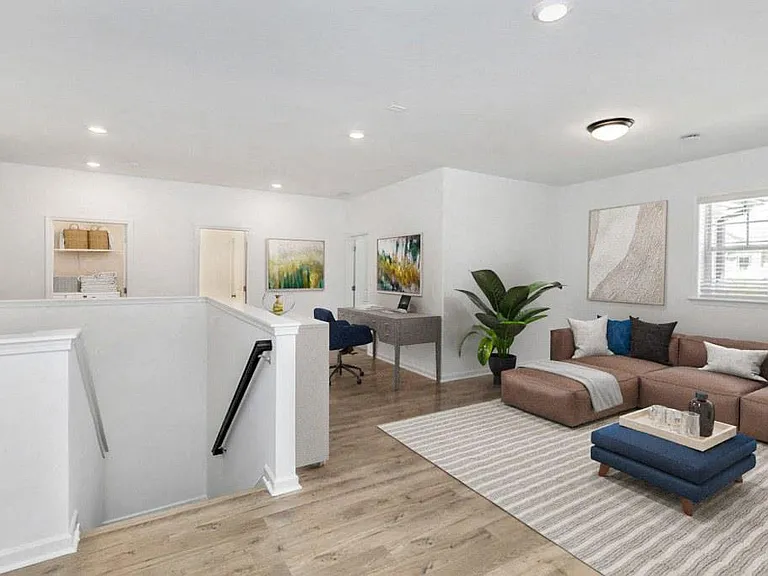 Loft area ideal for family gatherings just steps from the upstairs bedrooms.