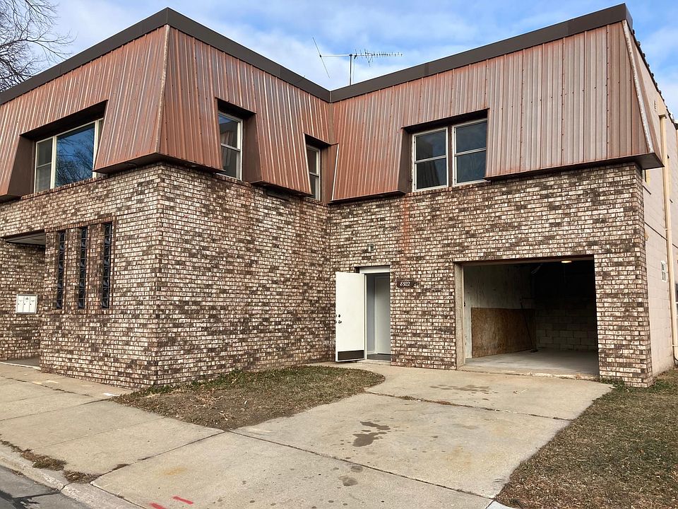 Front of building with your attached garage and off street parking spot.