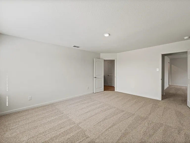 The master suite has a spacious bedroom, en-suite bathroom and walk-in closet.
