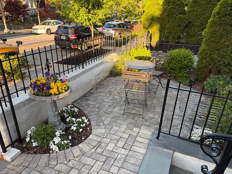 Enjoy your own private, sun-filled front patio, exclusively reserved for Unit 2, perfect for relaxing or entertaining outdoors.
