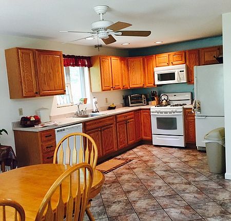 Kitchen with Dining Area : Oak cabinets and tiled floor