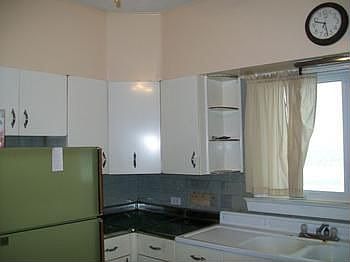 The kitchen has alot of light, plenty of space and tons of potential!