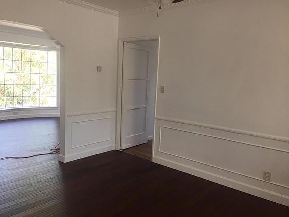 View of Living Room & Den. Hardwood Floors throughout. Wal