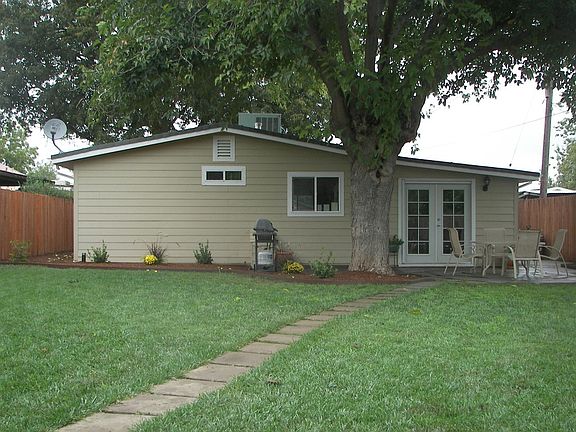 large landscaped yard with detached garage