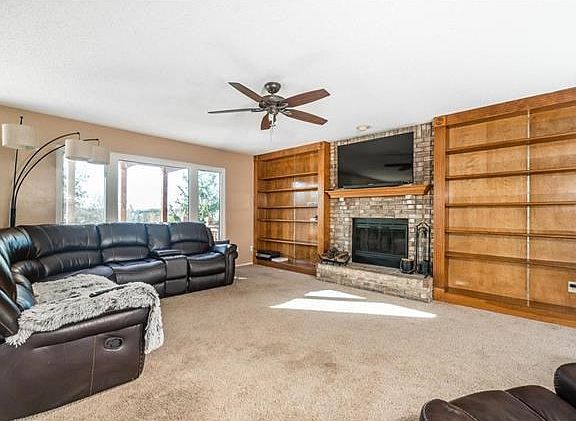 Family room w/ built in shelving.