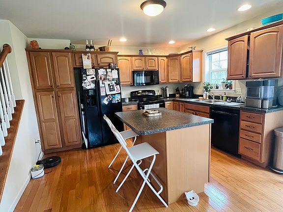 Level 2: Kitchen with island and new 2024 Bosch dishwasher.