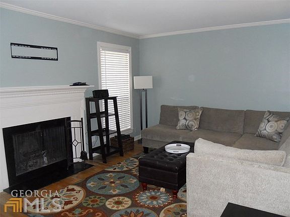 Family room with fireplace and hardwood floor