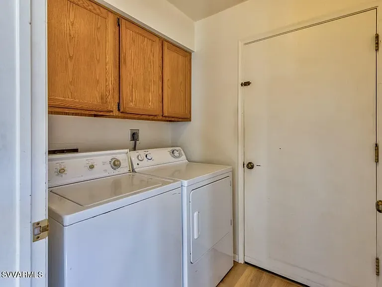 Utility room with washer & dryer.