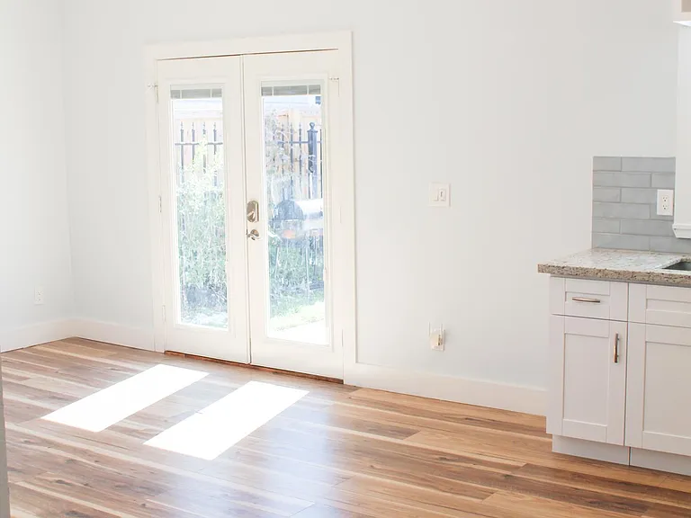 Double-door entry with built-in blinds. Outlets on every wall. Recessed lighting throughout.