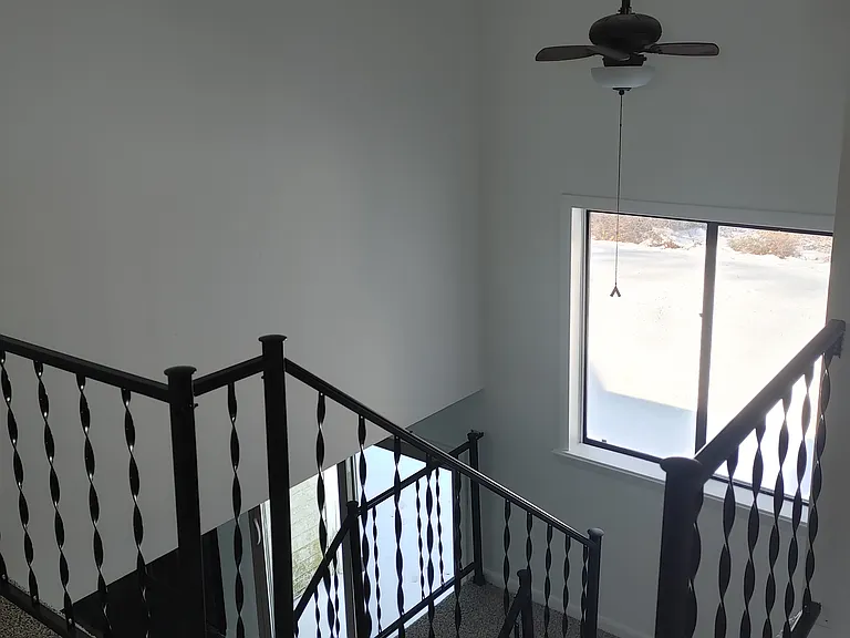 Same stairs going down to first floor