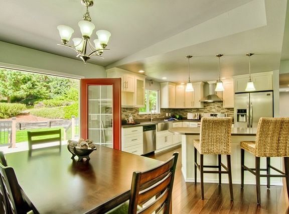 New French doors open to a brand new deck.