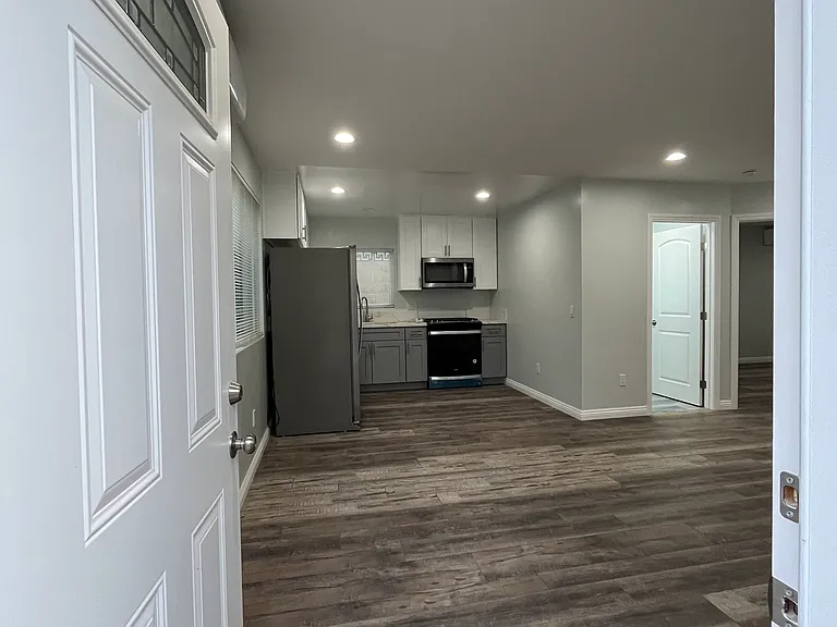 Opening into living room and kitchen.