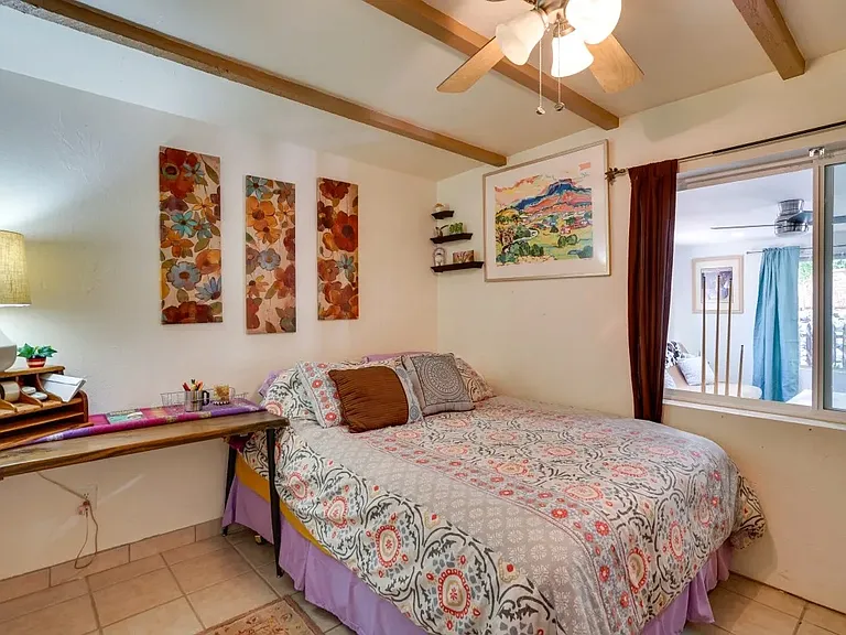 Bedroom with full bed and desk