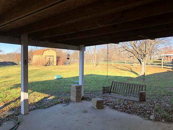 Covered patio in back yard.