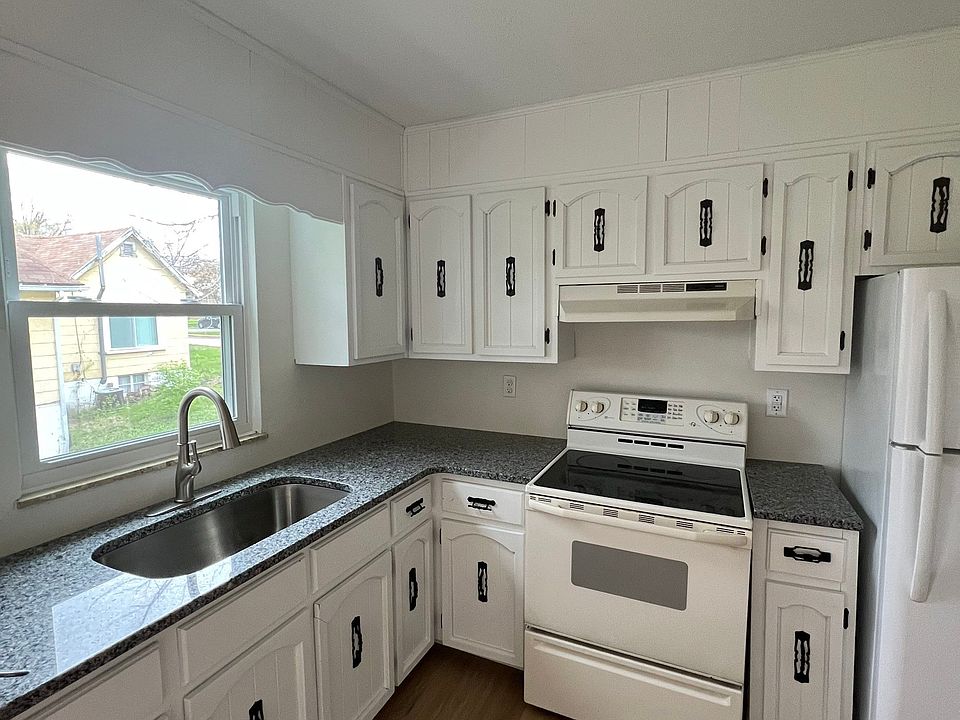 Newly updated kitchen with new appliances, granite countertops, and luxury vinyl plank flooring.