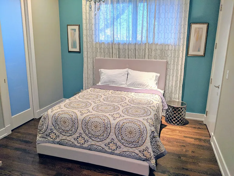 Primary bedroom w/ 2 walk-in closets and ensuite bathroom