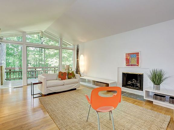 Living Room with Cathedral Ceiling and Fireplace