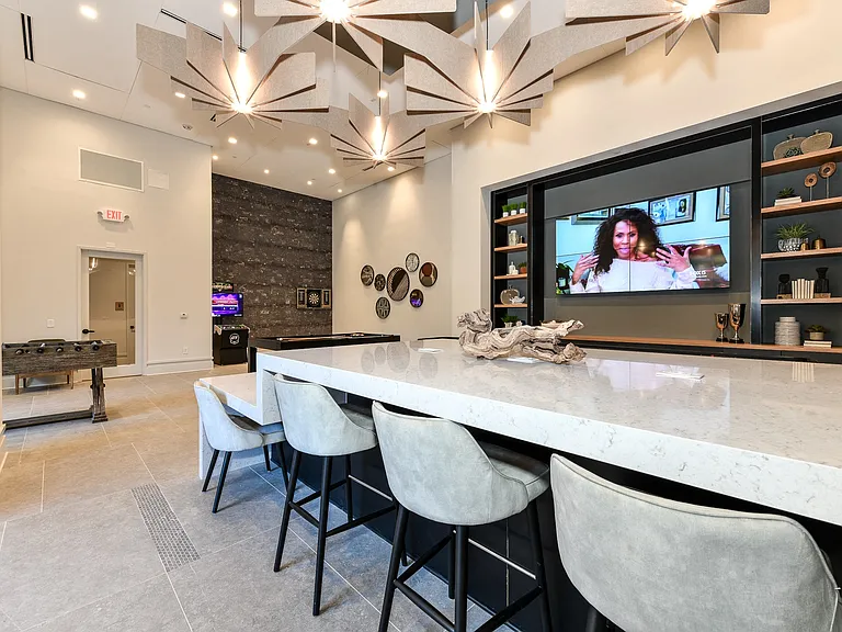 The game room is complete with bar seating and ample entertainment options.