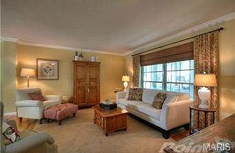 Living room offers hardwood flooring, custom window shade and cr